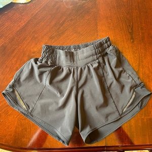 Lululemon Shorts in black w/ side zip pocket.